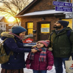 A refugee family in a snowy Canadian neighborhood, holding a Canadist bag, representing a new beginning and asylum in Canada.