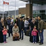 An editorial photo showing the recent Canada asylum system changes with families waiting outside a government facility.