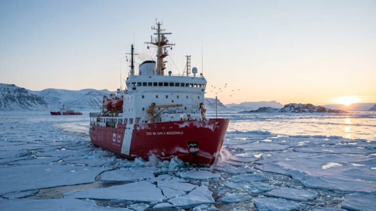Canada Coast Guard icebreaker sailing through Arctic sea ice