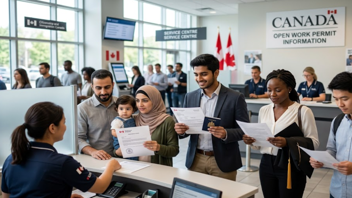 A diverse group of newcomers and international workers holding documents at a Canadian immigration service center.