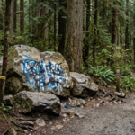 Memorial rocks with graffiti at Golden Ears Provincial Park in British Columbia