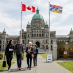 British Columbia Legislative Assembly building in Victoria, Canada, with Canadian and British Columbia flags, illustrating the provincial election results.
